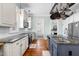 Modern kitchen featuring white cabinets, subway tile backsplash, and stainless steel appliances at 524 Beckwith Ave, Clayton, NC 27527