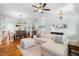 Open-concept living and dining area with hardwood floors, stylish decor, and a large comfortable sofa at 524 Beckwith Ave, Clayton, NC 27527