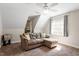 Cozy bedroom offers carpet, a sofa, and a window that lets in plenty of natural light at 53 Stafford Cir, Clayton, NC 27527