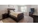 Comfortable bedroom featuring a large bed, bedside tables, and plenty of storage at 53 Stafford Cir, Clayton, NC 27527