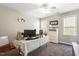 Bright bedroom features plush carpeting, a ceiling fan and plenty of natural light from two windows at 53 Stafford Cir, Clayton, NC 27527