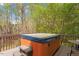 Relaxing deck area with a hot tub, perfect for unwinding and enjoying the outdoors at 53 Stafford Cir, Clayton, NC 27527