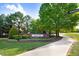 Welcoming community entrance sign surrounded by manicured landscaping and a sidewalk at 53 Stafford Cir, Clayton, NC 27527