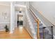 Welcoming foyer with hardwood floors, staircase, and access to dining room at 53 Stafford Cir, Clayton, NC 27527
