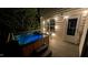 Relaxing hot tub on a wooden deck with outdoor seating and stylish lighting for evening enjoyment at 53 Stafford Cir, Clayton, NC 27527