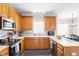 Well-equipped kitchen with wooden cabinets and modern appliances at 53 Stafford Cir, Clayton, NC 27527