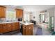 Bright eat-in kitchen with wooden cabinets and connected dining area at 53 Stafford Cir, Clayton, NC 27527