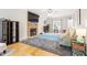 Comfortable living area featuring a stone fireplace, TV, and hardwood floors at 53 Stafford Cir, Clayton, NC 27527