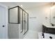 The bathroom features a sleek glass-enclosed shower with a modern tile surround and stylish fixtures at 555 Vine Pkwy, Pittsboro, NC 27312