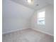 This bedroom offers a neutral palette, plush carpeting, and a window with outdoor views at 555 Vine Pkwy, Pittsboro, NC 27312
