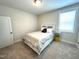 This bedroom has great light, a nice-sized closet, and great carpeting for a cozy feel at 555 Vine Pkwy, Pittsboro, NC 27312