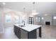 Modern kitchen with a large island, stainless steel appliances, and an open layout at 555 Vine Pkwy, Pittsboro, NC 27312