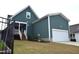 Charming home featuring a rear entrance and convenient garage access at 555 Vine Pkwy, Pittsboro, NC 27312