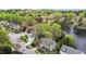 Wide aerial view of lake community surrounded by a dense forest at 6209 Remington Lake Dr, Raleigh, NC 27616