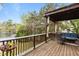 Relaxing back deck with pergola, comfortable seating, and scenic lake views at 6209 Remington Lake Dr, Raleigh, NC 27616