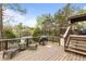 Lakeside deck with a grill and outdoor seating; perfect for entertaining at 6209 Remington Lake Dr, Raleigh, NC 27616