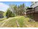Lush backyard with winding stone path leading to waterfront at 6209 Remington Lake Dr, Raleigh, NC 27616