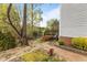 View of brick stairs leading to a two level wooden deck overlooking the lake at 6209 Remington Lake Dr, Raleigh, NC 27616