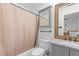 Bathroom features a tub with shower, toilet, vanity with mirror, and a gray granite countertop at 6209 Remington Lake Dr, Raleigh, NC 27616