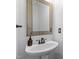 Modern bathroom featuring a stylish mirror, sleek sink, and minimalist design at 6209 Remington Lake Dr, Raleigh, NC 27616