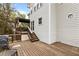 Spacious wooden deck featuring outdoor cooking space and stairs to access backyard at 6209 Remington Lake Dr, Raleigh, NC 27616