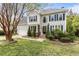 Lovely two-story home with a spacious two-car garage, attractive landscaping, and inviting front entrance at 6209 Remington Lake Dr, Raleigh, NC 27616