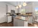 Bright kitchen featuring granite counters, stainless appliances and custom cabinetry at 6209 Remington Lake Dr, Raleigh, NC 27616
