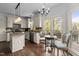 Beautiful kitchen showcasing a breakfast nook with scenic views and modern appliances at 6209 Remington Lake Dr, Raleigh, NC 27616