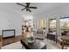 Open-concept living room with hardwood floors, comfortable seating, and access to the kitchen at 6209 Remington Lake Dr, Raleigh, NC 27616