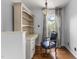 Office features a desk, bookshelf, and chair with hardwood flooring and natural light at 6209 Remington Lake Dr, Raleigh, NC 27616
