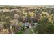 Aerial view of a home nestled in mature trees showcasing landscape and proximity to nature at 6719 Falconbridge Rd, Chapel Hill, NC 27517