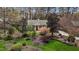 Aerial view of home with beautifully landscaped front yard and a well manicured lawn at 6719 Falconbridge Rd, Chapel Hill, NC 27517