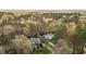 Aerial view of two homes nestled amongst the trees showcasing landscape and surroundings at 6719 Falconbridge Rd, Chapel Hill, NC 27517