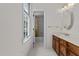 Bright bathroom with a sink, tub with shower and ample natural light at 6719 Falconbridge Rd, Chapel Hill, NC 27517