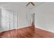 Spacious bedroom with hardwood floors, a ceiling fan, and a large closet at 6719 Falconbridge Rd, Chapel Hill, NC 27517