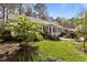 Charming home with landscaped front yard, vibrant foliage, and inviting curb appeal at 6719 Falconbridge Rd, Chapel Hill, NC 27517