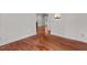 Hallway showing wood floors and flows into living areas, sunroom, and kitchen at 6719 Falconbridge Rd, Chapel Hill, NC 27517