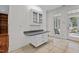 Additional kitchen area with built-in cabinets and outdoor access to the backyard at 6719 Falconbridge Rd, Chapel Hill, NC 27517