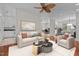 Living area showcasing fireplace and hardwood floors open to dining, kitchen, and office at 6719 Falconbridge Rd, Chapel Hill, NC 27517