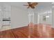 Bright living space featuring wood floors and seamlessly connects to kitchen and other living spaces at 6719 Falconbridge Rd, Chapel Hill, NC 27517