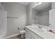 Neutral bathroom with tiled floors, walk-in shower, and vanity with a white countertop and sink at 676 Wall Rd, Wendell, NC 27591