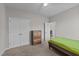 Spacious bedroom features a large closet, neutral carpet, and open door to a connecting room at 676 Wall Rd, Wendell, NC 27591