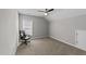 This bedroom features a ceiling fan, carpet, and plenty of natural light at 676 Wall Rd, Wendell, NC 27591