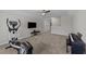 Large bonus room with ceiling fan, TV, exercise equipment, and piano at 676 Wall Rd, Wendell, NC 27591