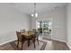 Dining area with a wood table and sliding glass doors to the outdoor deck at 676 Wall Rd, Wendell, NC 27591