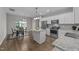 Kitchen with granite counters, island, stainless appliances, and an adjacent dining area at 676 Wall Rd, Wendell, NC 27591