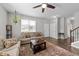 Cozy living room featuring hardwood floors, a ceiling fan, and neutral decor at 676 Wall Rd, Wendell, NC 27591