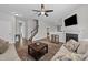 Comfortable living room with hardwood floors, fireplace, and access to the staircase at 676 Wall Rd, Wendell, NC 27591