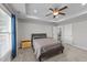 Spacious main bedroom featuring a trey ceiling, carpet, and ample natural light at 676 Wall Rd, Wendell, NC 27591