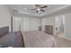 Comfortable main bedroom with carpet, trey ceiling, and ensuite bathroom access at 676 Wall Rd, Wendell, NC 27591